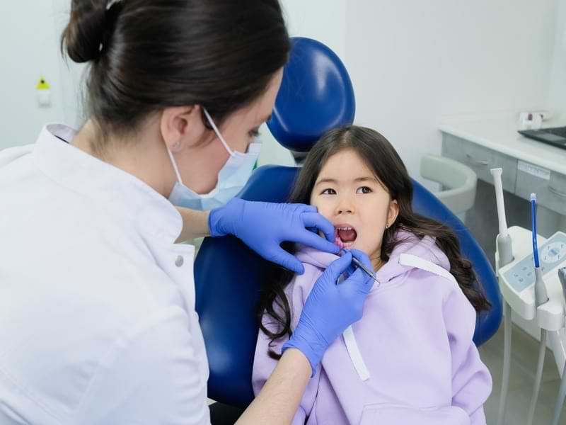 A Dentist And A Child